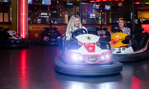 Two girls creating memories having fun on dodgems at namco funscape 